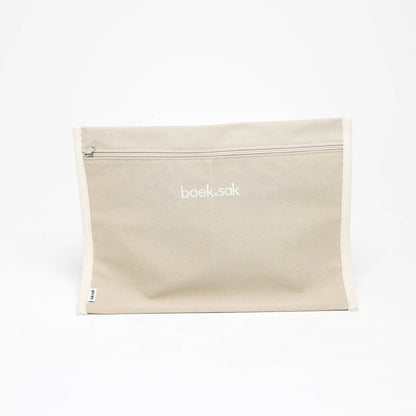 Beige pouch with 'book bag' branding on a white background