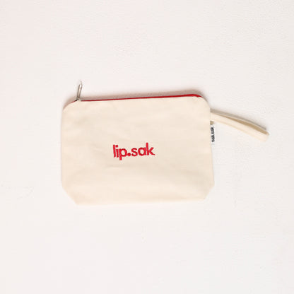 Small beige pouch with 'lip.sak' logo on a white background