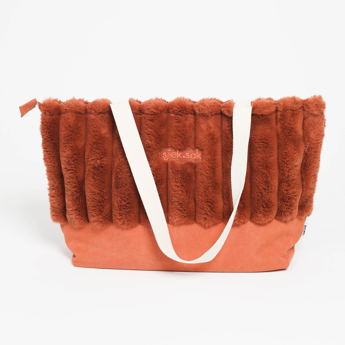 Red fluffy bag with a white strap on a white background